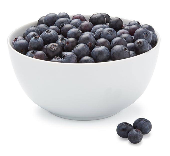 Fresh Organic Blueberries Pint in a white bowl, showcasing plump, ripe berries perfect for a sweet, healthy snack or smoothie ingredient.