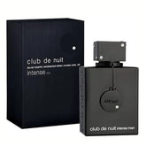 A black bottle of Armaf Night Club Wild Black Perfume for Men by Showlu Well Nation Store stands beside its sleek matching box, both with minimalist white text—a bold, long-lasting men’s fragrance with a modern, spicy edge.