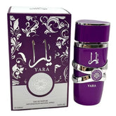 A purple Lattafa Yara perfume box with silver floral patterns and Arabic script stands next to a matching 100ml unisex bottle, both featuring Showlu Well Nation Store branding.