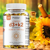 A bottle of Vitamin D3 10000 IU with K2 200 Mcg, 120 Soft-Gels for immune support, muscle function, and bone health sits on a wooden surface beside a glass oil jar, sunflower seeds, and sunflowers with another softly blurred in the background.