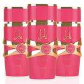 Three vibrant pink 100ml bottles of Lattafa Yara Candy Vanilla Fruity Citrus Floral Eau de Parfum by Showlu Well Nation Store, each accented with gold and Arabic script, are arranged side by side. This long-lasting fragrance is ideal for women.