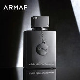 A black 100ML bottle of Showlu Well Nation Store's Armaf Club De Nuit Intense Man Pheromone Fragrance is displayed at an angle, with the brand and product names in white and a chain with medallion accenting the bold unisex design.
