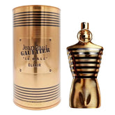 A gold, cylindrical canister labeled Jean Paul Gaultier stands next to a gold, striped torso-shaped bottle of Showlu Well Nation Store's High Quality Men's Perfume Charm Cologne.