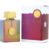 The Armaf Club De Nuit Intense Perfume by Showlu Well Nation Store features a colorful, iridescent unisex bottle with a gold cap and chain beside its white and purple box with gold accents. 3.6FL OZ, oriental woody scent for men & women.