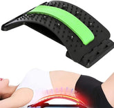 A woman uses the Showlu Well Nation Store Back Stretcher Multi-Level Adjustable Massager, arching over it to relieve lower back pain. The black and green lumbar support device with acupressure points is also shown separately above her for detail.
