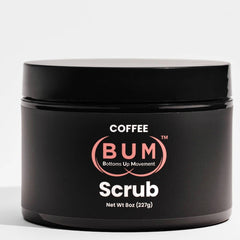 A black container labeled Coffee (BUM) Scrub by Showlu Well Nation Store, containing 8 oz (227g) of exfoliating foot, hand, body, and butt scrub with jojoba, rosehip, and vitamin E is shown against a plain white background.
