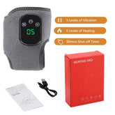 The Showlu Well Nation Store Electric Heat And Vibration Ankle Massager includes a gray heated wrap, digital display, manual, USB cable, and red box. It offers 3 vibration modes, 5 heat levels, and a 30-min timer for soothing ankle relief.