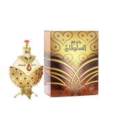 The KHADLAJ PERFUMES Hareem Al Sultan Gold Concentrated Perfume Oil (1.18 oz) from Showlu Well Nation Store comes in a jeweled gold and red bottle beside an ornate box with Arabic script and heart motifs, evoking its long-lasting unisex aroma.