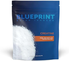 A blue resealable pouch labeled Blueprint Bryan Johnson Creatine Monohydrate Powder contains unflavored white powder, with 5g per serving and 100 servings, supporting muscle growth, recovery, strength & focus.