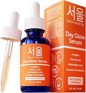 A blue dropper bottle of SeoulCeuticals Korean Skin Care 20% Vitamin C Hyaluronic Acid Serum + CE Ferulic Acid sits beside its orange box. This potent anti-aging serum targets wrinkles, promoting radiant, youthful skin.
