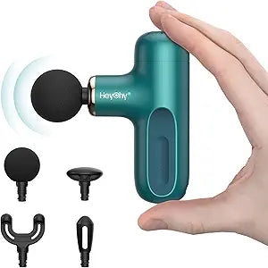 A hand holds the compact teal Super Mini Massage Gun with a round black attachment, featuring a high-torque brushless motor and four interchangeable heads for percussion deep tissue massage, ideal for home, gym, office, or travel use.
