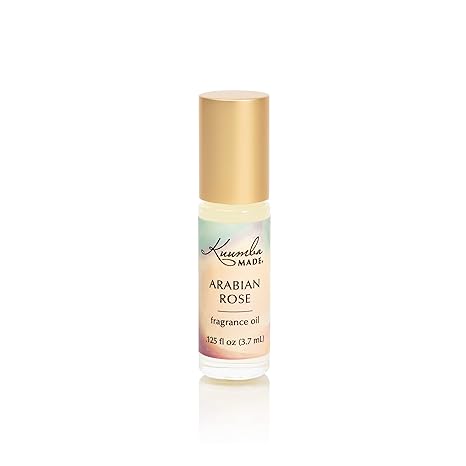 A 0.125 fl oz (3.7ml) rollerball bottle of Showlu Well Nation Store’s Arabian Rose Fragrance Oil Perfume, alcohol free, with a gold cap and labeled with the product name, set against a white background.
