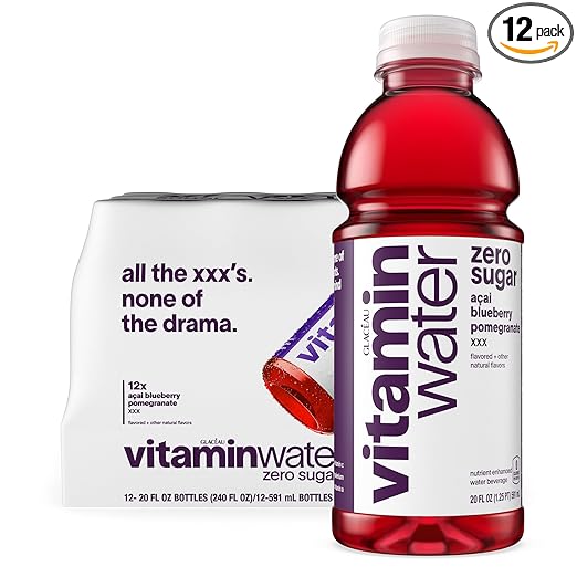 A bottle of vitaminwater XXX Acai-Blueberry-Pomegranate Zero Sugar sits beside its 12-pack box, labeled "all the xxxs. none of the drama," highlighting this zero sugar, antioxidant drink’s naturally sweet flavor.