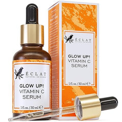 A bottle of Eclat Skincare Vitamin C Serum for face, with hyaluronic acid, ferulic acid, and vitamin E—an anti-aging and skin-brightening formula for dark spots—shown with dropper and orange-white box packaging. 1 fl oz size.
