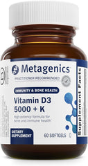 A brown bottle of Metagenics Vitamin D3 + K (5,000 IU, MK-7) dietary supplement contains 60 non-GMO, gluten-free softgels for artery, immune, bone & heart health. Supplement Facts are partially visible on the label.