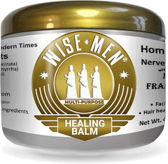 A jar of Wise Men Healing Balm with Myrrh and Frankincense Essential Oils, gold lid, and a white label featuring three wise men—perfect for soothing nerve relief or a relaxing foot massage.