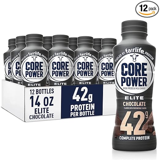 A 12-pack of Core Power Elite High Protein Shake, Chocolate flavor—each 14oz bottle delivers 42g protein for muscle recovery—displayed in a cardboard tray with one bottle highlighted in front.