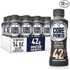 A 12-pack of Core Power Elite High Protein Shake, Chocolate flavor—each 14oz bottle delivers 42g protein for muscle recovery—displayed in a cardboard tray with one bottle highlighted in front.