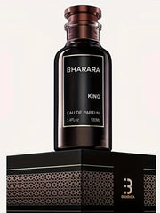 A dark brown bottle labeled Bharara King Eau de Parfum for Men sits on a black and gold patterned box with a stylized B logo. It features a citrus amber scent, ideal for confident daily wear and evening sophistication.