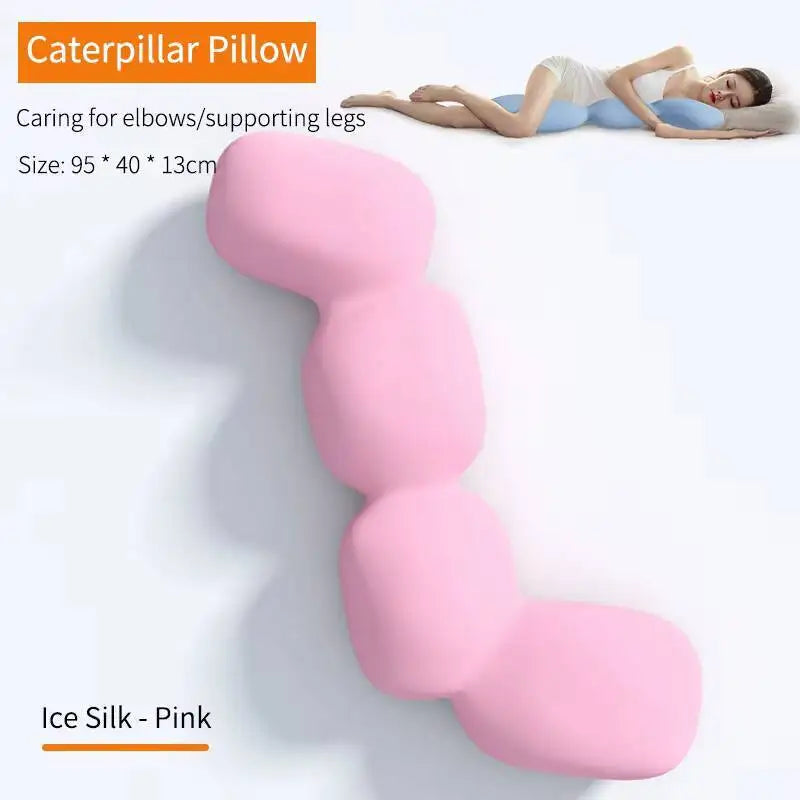 A woman uses the Memory Foam Hold In Bed Sleeping Body Pillow for Pregnant Women, a pink orthopedic caterpillar-shaped cushion (95x40x13cm) made of washable ice silk, designed for elbow and leg support.