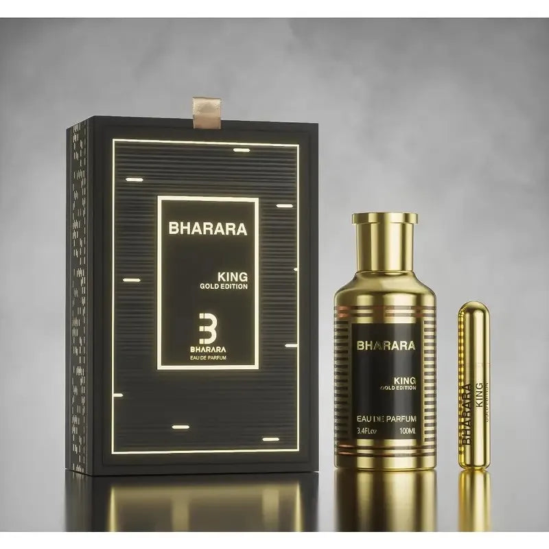 A black and gold box labeled Bharara Unisex 3.4 Ounce Eau de Parfum - Long-lasting sits next to a matching alcohol-free fragrance bottle and gold spray, all softly illuminated against a gray background for a luxurious look.