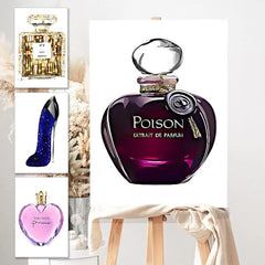 A canvas on an easel displays an illustrated purple perfume bottle labeled “Poison.” Next to it are Perfume Bottle Prints Nordic Poster Wall Art featuring Chanel No. 5, a blue high heel, and Vera Wang Princess.