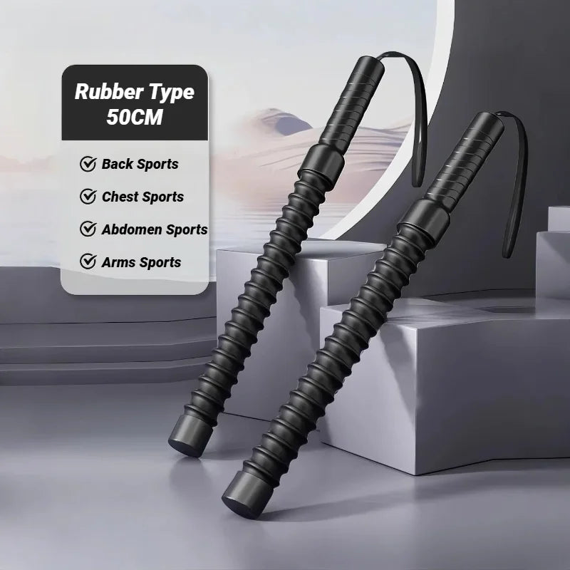 Two black Strength Training Bar Ergonomic Fitness Grip Biceps Triceps Strengthener Spring Arm Expanders with wrist straps are upright in a minimalistic indoor space. A sign notes they're for back, chest, abdomen, and waist workouts; length: 50 cm.