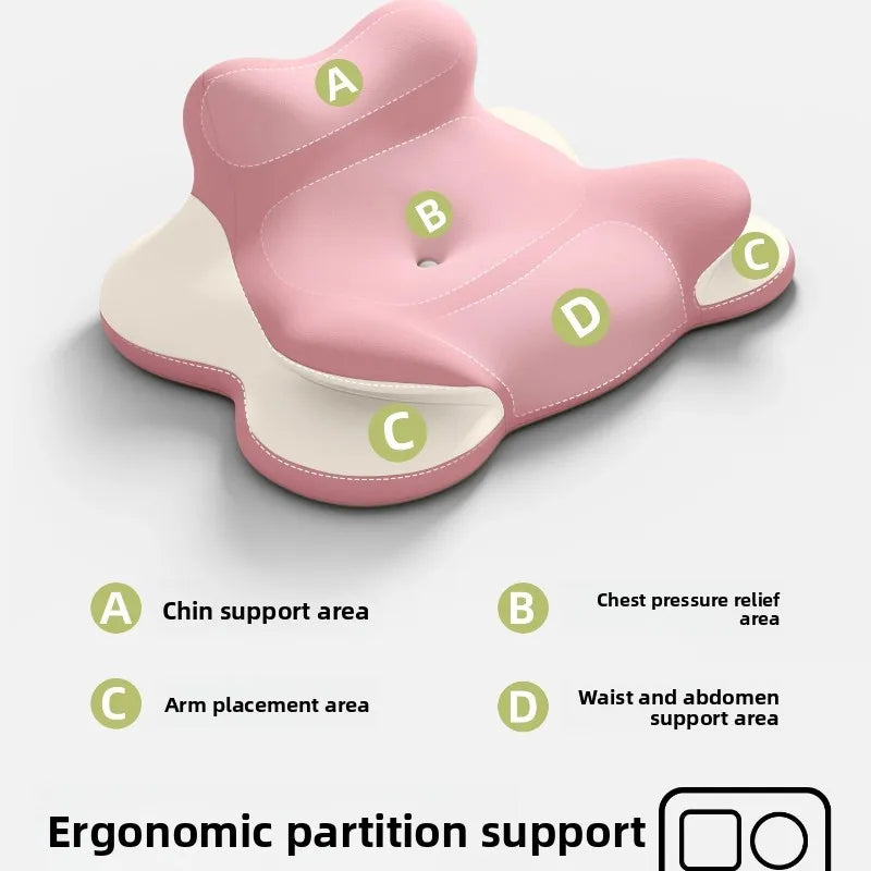 The Bed Lie Down Pillow features ergonomic pink and beige memory foam with labeled sections: A for chin support, B for chest relief, C for arms, and D for waist/abdomen. Text: Ergonomic partition support. Ideal as a leg pillow, backrest, or reading wedge.