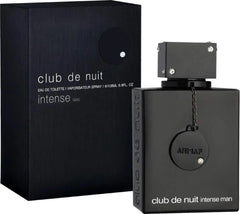 A 3.6oz (102.1g) black rectangular bottle of Armaf Club De Nuit Intense Man eau de toilette, wood spicy scent, is shown beside its matching black box, both with minimalist white text and silver accents.