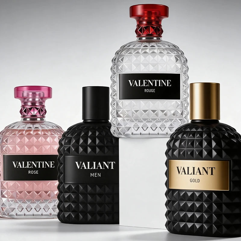 Four elegant 3.4 Fl Oz Eau De Parfum bottles, featuring Mandarin Orange, Orange Blossom & Bergamot fragrances for men and women, are displayed on a reflective surface—perfect Christmas gifts from Mainland China against a gray backdrop.