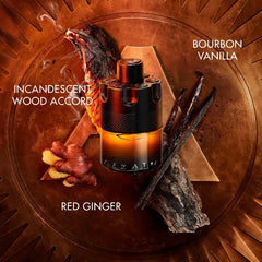 A 100ml Azzaro Wanted Series Eau De Parfum Spray for men rests on wood with ginger slices, vanilla beans, and wood, highlighting scents of Incandescent Wood Accord, Bourbon Vanilla, and Red Ginger—an alluring luxury cologne.