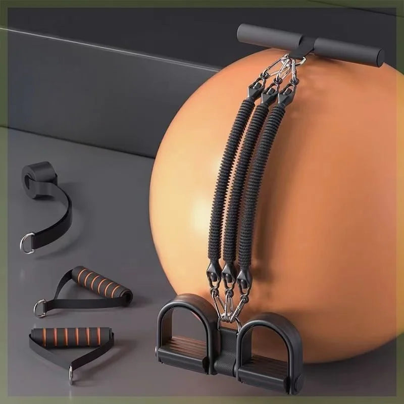 The Pedal Tension Rope Abdominal Strength Elastic Rope is a peach-colored, multi-functional fitness band with black resistance bands, handles, foot pedals, and grip handles, all placed on a gray surface for versatile exercise options.