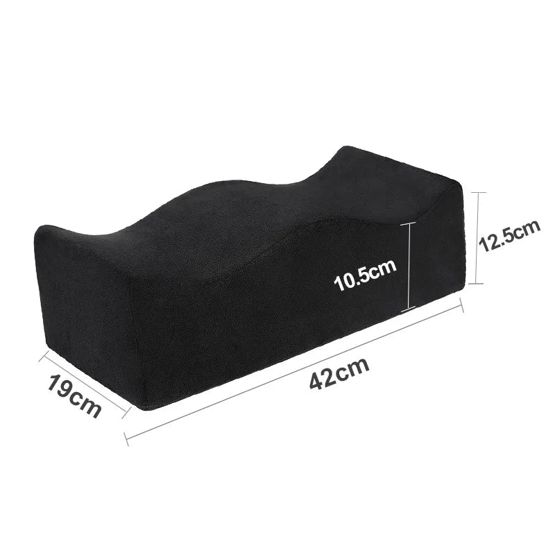 The BBL Pillow Seat Pad is a black contoured memory foam cushion (42 x 19 x 12.5 cm, center 10.5 cm) with plush fabric and ergonomic curves, ideal for hip surgery rehab. It features a removable, washable cover for easy care.