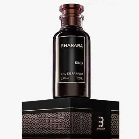 A dark glass bottle of Bharara King For Men Eau de Parfum spray (3.4 Oz / 100 ML) with a metallic cap and minimalist black label is displayed on its black and gold-patterned box against a light background. NEW IN BOX.