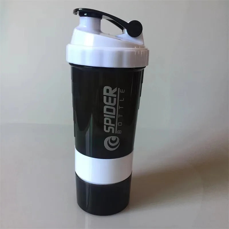 A black and white 3 Layers Shaker Protein Bottle with flip-top lid, side handle, and vertical Spider Bottle logo stands upright—ideal for fitness enthusiasts in Mainland China. Large capacity; perfect for protein shakes and workouts.