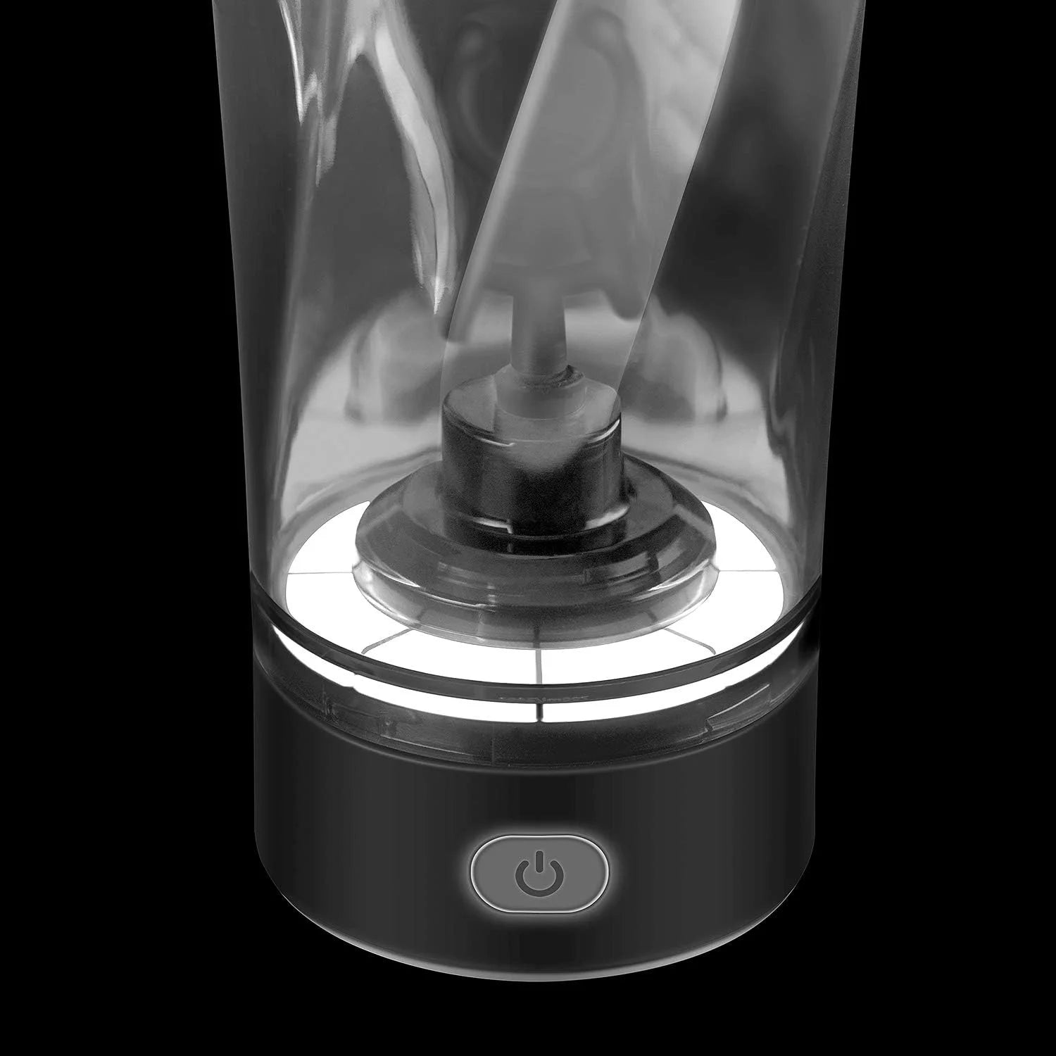 Close-up of the base of the Premium Electric Protein Shaker Bottle USB Rechargeable Portable Mixer Cup, showing its visible blade inside a transparent container. The black base has a circular power button and supports USB charging. Background is solid black.