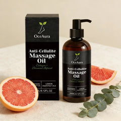 A bottle and box of Anti Cellulite Oil Firm Skin Tightening with lemon and grapefruit essential oils, plus eucalyptus leaves and grapefruit slices, displayed on a beige surface. The label highlights collagen and hydrating plant extracts.