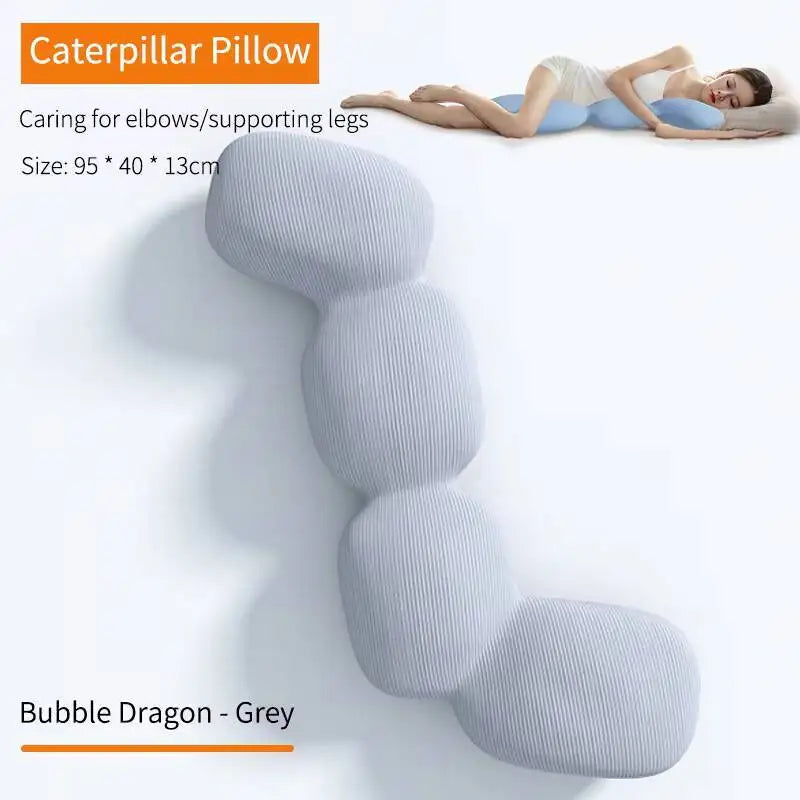 A person hugs a segmented, grey pillow shaped like four bubbles. Text: Memory Foam Hold In Bed Sleeping Body for Pregnant Women, Orthopedic Long Pillow, ice silk cover, elbow/leg support; color: Bubble Dragon - Grey.
