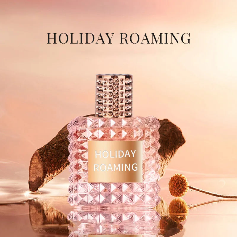 A pink, textured bottle labeled "Rivet Series Fresh Perfume" sits on a reflective surface with a blurred, warm-toned background and natural decor, hinting at its long-lasting woody, fruity, and floral bergamot fragrance for ladies.