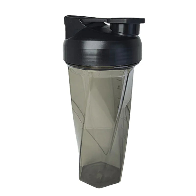 The 600ml Vortex Mixer Shaker Bottle is made from high-quality TRITAN, featuring a black lid, flip-top spout, and geometric design—an ideal gym essential for mixing protein shakes.