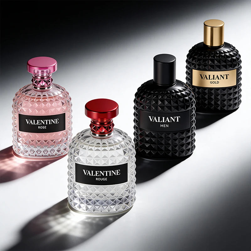 Four perfume bottles—pink, red, black, and gold—hold 3.4 Fl Oz unisex, alcohol-free Eau De Parfum (Mandarin Orange, Orange Blossom & Bergamot), perfect for Christmas gifts and arranged on a gradient-lit surface.