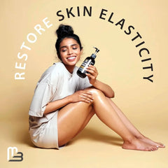 A smiling woman with bare legs sits on the floor, holding M3 Naturals Anti-Cellulite Massage Oil with grape seed and eucalyptus oils. Text reads, "Restore Skin Elasticity." A soft beige background enhances this beauty scene inspired by Mainland China.