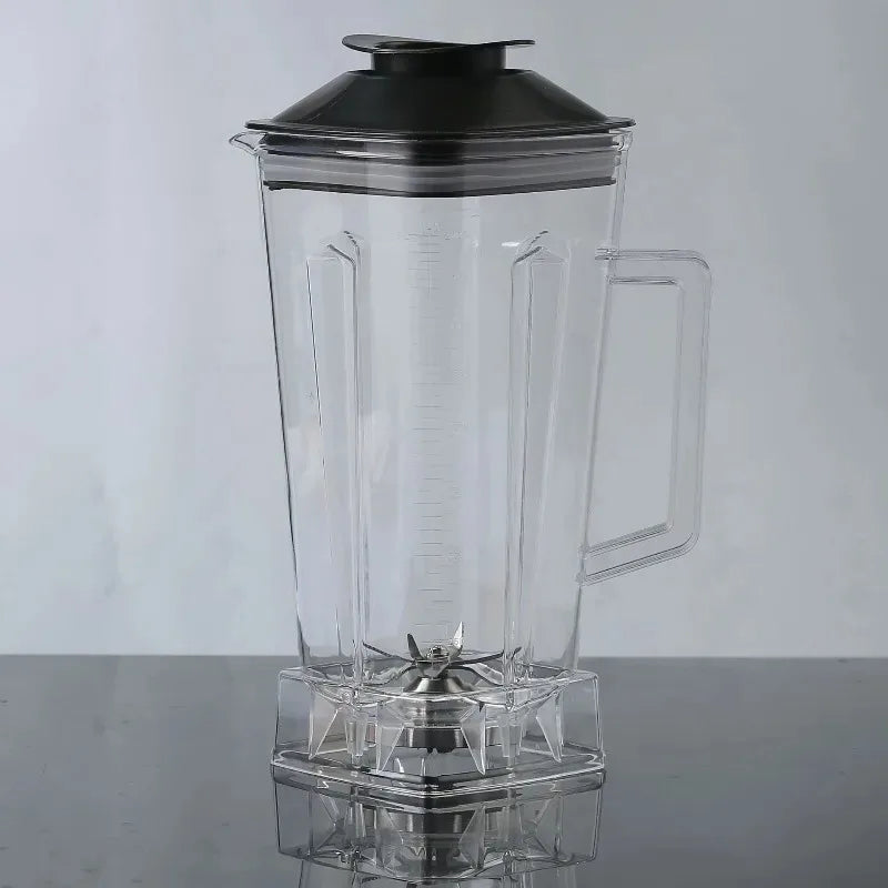 The For SILVER CREST Blender Spare Jug, a 2L transparent plastic replacement part with black lid and handle, made in Mainland China, sits on a reflective surface. Its metal blade is visible inside this portable blender jar.