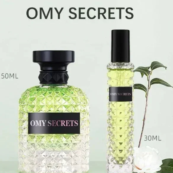 Two Miss Adventure Donna Perfume Luxury Spray bottles—a 50ml round textured and a 30ml slender spray—filled with light green liquid, sit beside a plant, both offering a floral fruity rose jasmine scent perfect for daytime wear.