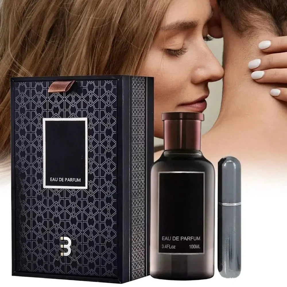 A woman with closed eyes leans against a man's neck. In the foreground is a high-end gift box containing a sealed 100ML Eau De Parfum For Men, a black perfume bottle, and a silver atomizer.