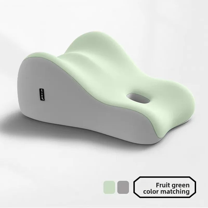 A contoured, light green and gray Intimacy Support Wedge Pillow for Couples is shown on a white background, featuring a hole near one end. Includes color swatches labeled "Fruit green." Made in Mainland China.
