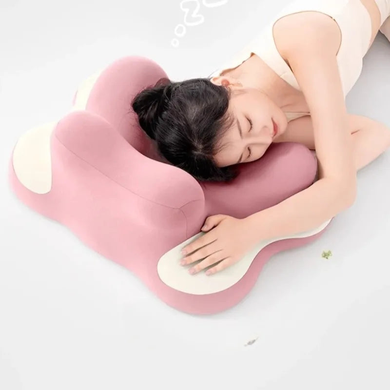 A woman lies on her side, resting her head and arms on the Bed Lie Down Pillow Multifunctional Prone Position Lie Down Pillow Leg Pillow, Backrest Pillows Sleep Reading Wedge Pillows.