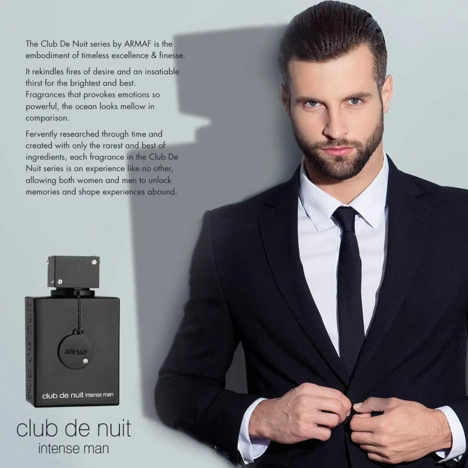 A well-groomed man in a suit adjusts his jacket beside a large bottle of Armaf Club De Nuit Intense Man eau de toilette, 3.6oz (102.1g), wood spicy, with fragrance description text highlighting this bold scent in the background.