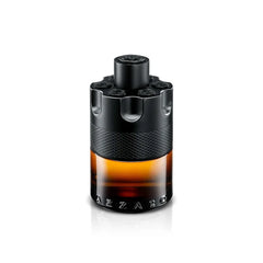 A 100ml bottle of Azzaro Wanted Series Eau De Parfum Spray for men, French luxury cologne, features a cylindrical design with a black revolver-style top, textured band, and amber-colored glass base.