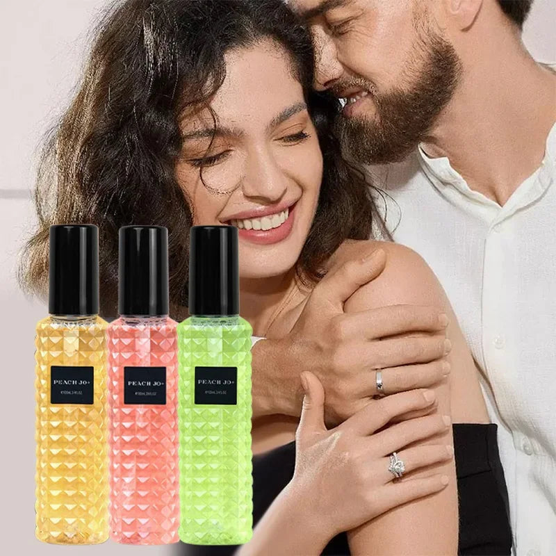A man in a white shirt embraces a smiling woman. In the foreground, three colorful Rivet Series Fresh Perfume bottles—woody, fruity, floral fragrances for ladies—are displayed in yellow, pink, and green.